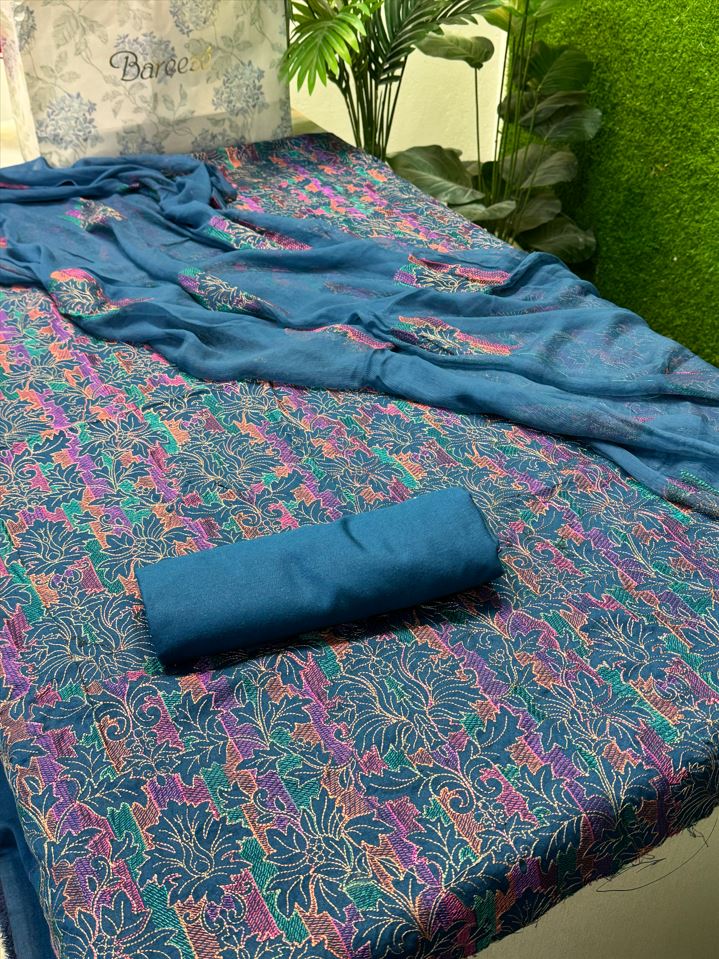 Premium Blue Bareeze Karandi 3-Piece Suit featuring intricate floral embroidery on shirt canvas with pure crinkle chiffon dupatta.