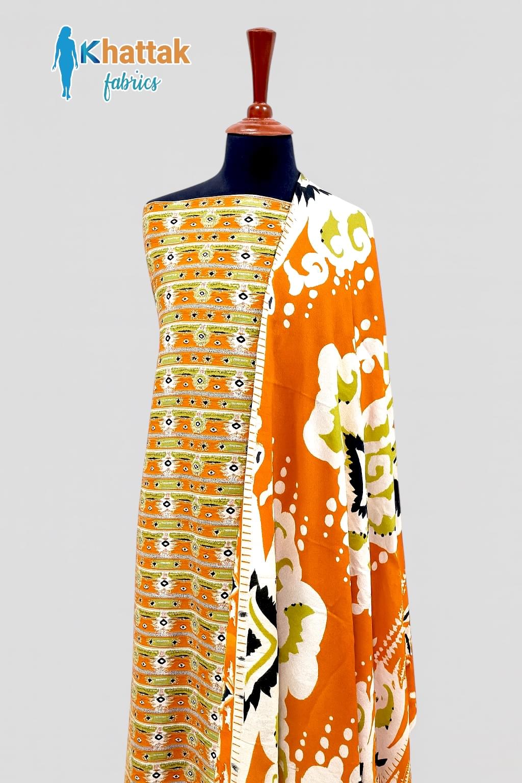 "Orange printed khaddar unstitched 3 piece suit with bold floral and tribal patterns by Khattak Fabrics"